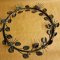Blomsterkrans i patineret metal