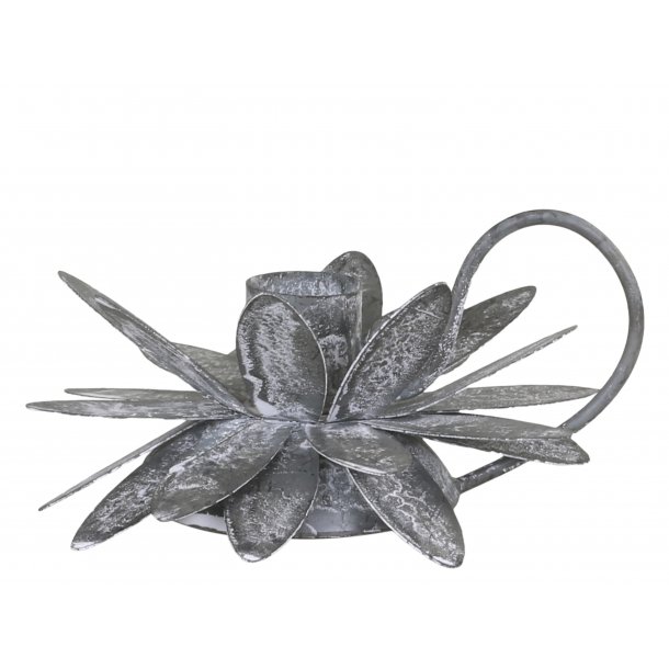 Kammerstage med blomst til bedelys